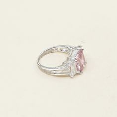 Size 5.75, Vintage Sterling silver fashion ring, 925 silver with emerald cut pink Quartz and clear crystal details, stamped 925 Formal Pink Sterling Silver Diamond Ring, Pink Sterling Silver Crystal Ring With Center Stone, Fine Jewelry Pink Radiant Cut Rings, Pink Diamond Ring In Sterling Silver With Vs Clarity, Pink Diamond Ring With Vs Clarity In Sterling Silver, Pink Sterling Silver Diamond Ring With Vs Clarity, Pink Sterling Silver Crystal Ring For Formal Occasions, Pink Emerald Cut Sterling Silver Ring, Fine Jewelry Pink Rectangular Rings