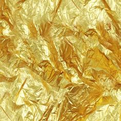 an image of gold foil that is very shiny and has been used as a background or wallpaper