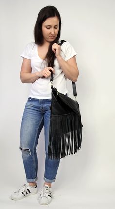 Black Leather Bag, Fringed Cross Body Bag, Women fringe hobo bag, Hobo bag purse. This bag with tassels of suede leather, can be worn as a large purse or small crossbody. This leather bag is a perfect everyday bag! There is a lot of space and you can put there everything in your everyday life. * Lined * Includes internal pockets for mobile phone and other small items. Dimensions: height: 37 cm (14.6 in) Width on the top: 28 cm (11 in) width on the bottom : 34 cm (13,4) strap: max 125 cm (49.2 in Everyday Use Bag With Fringe, Black Tasseled Hobo Bag, Everyday Bucket Shoulder Bag With Tassels, Festival Hobo Bag With Tassels, Black Hobo Bag With Fringe For Daily Use, Black Fringe Hobo Bag For Daily Use, Travel Fringe Crossbody Shoulder Bag, Fringe Crossbody Shoulder Bag For Travel, Everyday Bohemian Shoulder Bag With Tassels