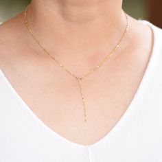 "14k Gold Y Necklace. 14K sparkle chain necklace. 14k delicate y necklace. This necklace is beautiful and delicate. The necklace will arrive in a gift box, ready for delivery. 14K gold necklace 14K gold drop chain (The picture in the listing is 2\") All components are 14k gold Please read our policies before you place your order. https://www.etsy.com/shop/SashJewelry/policy?ref=shopinfo_policies_leftnav To see other bracelets click here https://www.etsy.com/shop/SashJewelry?section_id=12354075&a Dainty 14k Gold Long Drop Necklaces, Dainty Long Drop 14k Gold Necklace, Dainty 14k Gold Long Drop Necklace, 14k Gold Lariat Necklace With Delicate Chain, Dainty Yellow Gold Lariat Necklace With Clavicle Chain, Dainty Yellow Gold Backdrop Necklace With Clavicle Chain, Delicate Yellow Gold Lariat Backdrop Necklace, Delicate Long Drop Backdrop Necklace In Yellow Gold, Delicate 14k Gold Lariat Necklaces