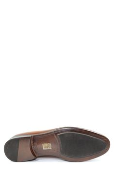 A single monk strap creates a wrap effect on this classic dress shoe. Round toe Monk buckle strap closure Leather upper and sole Imported Classic Cap Toe Monk Strap Shoes With Branded Insole, Brown Monk Strap Shoes For Semi-formal Occasions, Brown Closed Toe Monk Strap Shoes For Semi-formal Occasions, Classic Slip-on Closed Toe Dress Shoes, Brown Goodyear Welted Monk Strap Shoes With Round Toe, Formal Monk Strap Shoes With Round Toe, Semi-formal Monk Strap Shoes With Rubber Sole, Timeless Monk Strap Wingtip Shoes With Rubber Sole, Timeless Wingtip Monk Strap Shoes With Rubber Sole