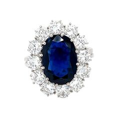 This 18K white gold lovely ring is from our Timeless Collection. It is made of a beautiful siam blue oval shape sapphire 4.80 Carat decorated by 12 round shape natural white diamonds in total of 2.48 Carat. Total metal weight is 6.5 gr. Extraordinary piece for any occasion! The Timeless Collection was inspired by the endless elegance and sophistication of classic high-jewelry, eternising it’s beauty and presenting a selection of classy designs. The intense colours stones give the collections aut Luxury Cluster Sapphire Ring Gia Certified, Luxury Gia Certified Cluster Sapphire Ring, Luxury Sapphire Cluster Ring With Brilliant Cut, Luxury Sapphire Diamond Ring With 17 Jewels, Gia-certified Cluster Sapphire Ring With Diamond, Gia Certified Cluster Sapphire Ring With Diamond, Luxury Sapphire Birthstone Ring For Formal Occasions, Gia Certified Cluster Sapphire Ring, Formal Vvs Clarity Cluster Sapphire Ring