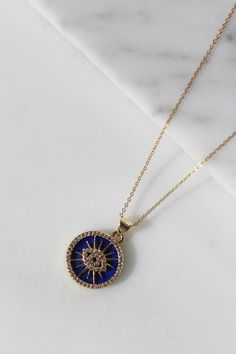 Good vibes only with this beautiful piece! 14k gold filled chain 18k gold filled enamel eye pendant set on a beautiful Lapis Lazuli Stone Enhance your jewelry collection with our stunning Lapis Lazuli Evil Eye Necklace, meticulously crafted in gold-filled material. This exquisite piece combines the timeless beauty of lapis lazuli with the protective charm of the evil eye, making it a perfect accessory for any occasion. Features: • Premium Quality: Our necklace features a genuine lapis lazuli sto Yellow Gold Evil Eye Medallion Jewelry, Evil Eye Enamel Jewelry As A Gift, Yellow Gold Medallion Jewelry With Evil Eye, Yellow Gold Jewelry With Evil Eye Medallion, Evil Eye Enamel Jewelry Gift, Gold Medallion Necklace With Evil Eye, Spiritual Gold Enamel Necklace, Tarnish Resistant Enamel Jewelry Gift, Gold Evil Eye Round Jewelry