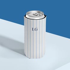 a white and blue can with the word lg on it sitting on a table