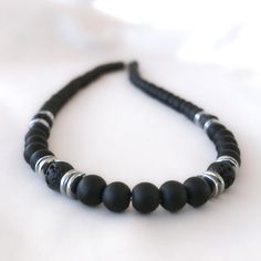 Black Necklace Choker Our Unique Style Matte Onyx, Volcanic Lava Stones and Silver Colored Hematite Beaded Necklace is our late 2023 design. It is a brand new necklace for those looking for a Christmas Gift. # You can buy our Black Lava Choker necklace with 2 options. - You can buy #1 Black Onyx Lava Necklace with 6mm option. - You can buy #2 Black Onyx Lava Necklace with 8mm option. - The necklace length you see in the pictures is 16 inches. Materials: 6mm Onyx round beads, 6mm Lava, 6mm Hemati Black Beaded Necklaces With 8mm Round Beads, Black Beaded Necklaces With 8mm Beads, Adjustable Black Beaded Necklaces With 8mm Beads, Minimalist Black Beaded Necklace With Gemstones, Minimalist Hematite Round Bead Jewelry, Minimalist 8mm Onyx Bead Jewelry, Minimalist Black Gemstone Beaded Necklaces, Adjustable Black Necklace With 8mm Beads, Black 8mm Beads Jewelry For Meditation