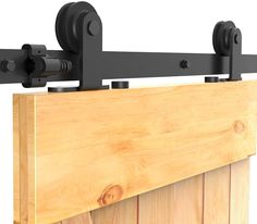 a close up of a wooden rail with two black handles