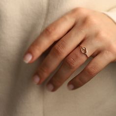 14K Solid Gold Love Knot Ring: A simple knot to symbolize infinite love, this minimalist ring will make the perfect birthday gift, Valentine's day gift, or Mother's day gift for all of the special people in your life.  Materials & Specifications: - 14K solid gold - Available in 3 options: Yellow Gold, Rose Gold, or White Gold  As with all of our products, this item is handmade and made to order. **WEARING YOUR JEWELRY** Show your love to your beautifully handcrafted pieces!  Although we stand behind the craftsmanship of our jewelry, our pieces are delicate and not made to be worn during sports and activities such as cleaning and gardening.  When wearing thin/dainty chain bracelets, take care to avoid getting them caught (e.g. on knit sweaters, blankets, or while searching for items in a pu Minimal Gold Jewelry, Gold Knot Ring, Love Knot Ring, Future Engagement Rings, Minimal Ring, Infinite Love, Dainty Gold Rings, Celestial Necklace, Stylish Rings