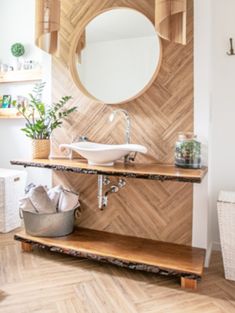 a bathroom with a sink, mirror and toilet