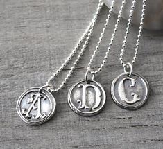 "Personalized Silver Wax Seal Initial Necklace - Fine Silver Custom Initial Charm with Sterling Silver Ball Chain This pendant is gorgeous and has such a great silver feel! The pendants are beautifully handcrafted and not machine cut, and each one has an organic handcrafted look and every letter is unique. This listing is for **ONE personalized initial necklace** with your choice of letter. ● CUSTOMIZED for you with *ONE* LETTER of YOUR CHOICE (A - Z) ● Please leave your choice of letter in the Symbolic Stamped Necklace For Anniversary, Symbolic Stamped Necklace For Gift, Symbolic Stamped Necklace For A Gift, Symbolic Sterling Silver Engraved Charm Necklaces, Classic Silver Engraved Necklace, Silver Medallion Necklace For Anniversary Gift, Symbolic Hand Stamped Jewelry Gift, Symbolic Hand Stamped Jewelry As Gift, Engraved Sterling Silver Necklace