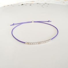 Minimalist, wearable and delicate silver multicolor thread bracelet available in several colors. Length: 20cm adjustable knot. Width: 2mm. Fully adjustable, Handmade in Spain. More colors available in this product => https://www.etsy.com/listing/845364478/tiny-simple-cord-sterling-silver-wish Ideal for a gift and for combinate with other bracelets. All our products are presented in a white organza bag. ♡ Made with love in Valencia ♡ ----------------------------- Discover the NICTE bracelets c Handmade Minimalist Friendship Bracelets, Simple Adjustable Sterling Silver Bracelets, Adjustable Simple Sterling Silver Bracelet, Minimalist Beaded Bracelets With Adjustable Length, Minimalist Friendship Bracelets With Round Beads, Minimalist Resizable Beaded Bracelets, Adjustable Friendship Bracelets With Silver Beads As Gift, Minimalist Adjustable Friendship Bracelets, Minimalist Silver Beaded Bracelets With Adjustable Length