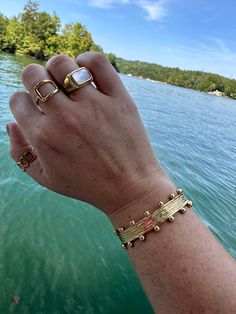 Easily adjustable cuff bracelet with brushed 18k gold stainless steel with dot detailing. Pictured on 6” wrist. The bracelet is adjustable and can open for larger wrist and can close for smaller. Cuff Bracelet, 18k Gold, Dots, Bangles, Cuff, Gold