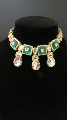 This beautiful choker is a modern twist to traditional jewelry and comes in a gold finish with green stones to match any outfit as desired. The choker is made of high quality stones and is a statement piece that can be dressed accordingly. The set comes with matching earrings for a complete look. Green Temple Jewelry With Jewels, Festive Green Jewelry With 17 Jewels, Green Bridal Necklace With 17 Jewels For Festivals, Green Kundan Jewelry With Jewels, Green Kundan Necklace For Formal Festivals, Green Chandbali Jewelry For Formal Occasions, Hand Set Green Gold Plated Jewelry, Gold Kundan Necklace With Stones For Formal Occasions, Green Hand Set Kundan Necklace In Temple Style