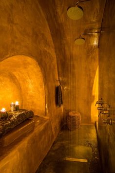 a bath room with a tub and candles