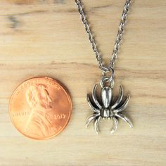 ♥ Spider Necklace Silver Spider Charm Necklace Spider Charm Insect Charm Spider Gift Spider Jewelry Birthday Gift Personalized Initial Chain ♥ You will receive 1 necklace ♥ Spider charm 18x14x3 mm ♥ Stainless steel chain 18 inches ♥ We strive for next day shipping, but we do not ship on Saturdays, Sundays, and Holidays. It may sometimes take a bit longer when we have unusually large volume of orders. Thank you for your patience! ♥♥ For more details on shipping guideline and other policies, pleas Halloween Novelty Necklaces As Gift, Silver Novelty Charm Necklace For Gift, Novelty Silver Charm Necklace For Gift, Halloween Themed Jewelry Gift, Themed Necklace With Lobster Clasp As Gift, Halloween Gift Necklace With Lobster Clasp, Angel Wing Gifts, Spider Jewelry, Spider Necklace