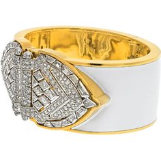 Bask in the brilliance of fine craftsmanship and innovative design with the David Webb Platinum & 18K Yellow Gold White Enamel Shield Diamond Clips Cuff Bracelet. This exquisite piece of jewelry exudes old Hollywood glamour, featuring platinum diamond shield-shaped ends that can be detached and worn as double clips. Adorned with a dazzling array of step-cut and brilliant-cut diamonds, this bracelet is a testament to elegance and sophistication.The design, crafted with white enamel, imbues the piece with a timeless quality, ensuring it remains a cherished heirloom for generations. Measuring around 6 inches in circumference, this bracelet is designed for a small wrist size, making it a perfect fit for those who appreciate bold yet refined accessories. The width of approximately 1.2 inches en Luxury Diamond Bangle With Polished Finish, Luxury Yellow Gold Evening Cuff Bracelet, Luxury Yellow Gold Cuff Bracelet For Evening, Luxury Diamond Cuff Bracelet With Diamond Accents, Luxury Cuff Bracelet With 17 Jewels For Anniversary, Luxury White Diamond Bracelet For Anniversary, Luxury Evening Cuff Bangle, Luxury Cuff Bangle For Evening, Luxury Cuff Jewelry For Evening