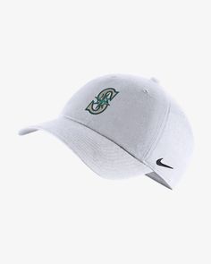 a white nike cap with the boston celtic logo on it's visor, against a light gray background