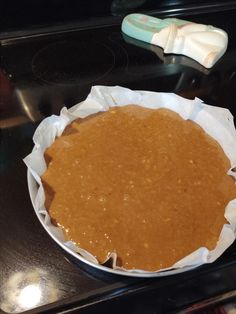 a pie sitting on top of a stove next to an oven