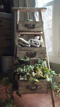 an old wooden ladder is used as a planter and storage unit for various plants