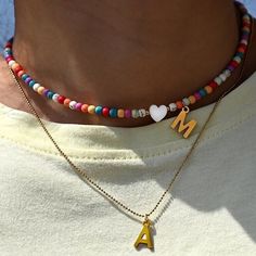 Our Colorful Beaded Initial Heart Necklace is a perfect gift for you and your loved one ♡ * Finish: Sterling Silver ∙ 18K Gold Plated ∙ Bead Color of Your Choice How To Order: * Design can be personalized with your initial bead color. * Use the 'PERSONALIZATION BOX' to let us know the INITIAL/LETTER you would like. More Info: * If you can't find the information you need, feel free to message me. I am fast to reply :) Shipping Time: * All items are custom-made to order and ship same day. Our deli Heart Shaped Letter Beads Jewelry For Valentine's Day, Valentine's Day Multicolor Beaded Necklaces, Heart-shaped Colorful Beaded Necklaces As Gift, Heart Shaped Colorful Beaded Necklaces For Gifts, Colorful Beads Heart Shaped Beaded Necklace Gift, Heart-shaped Letter Beads Jewelry As Gift, Heart-shaped Letter Beads Jewelry For Gift, Dainty Heart Beaded Necklaces As Gift, Heart Shaped Beaded Necklace For Gift