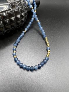 Blue Sapphire necklace with 14K gold plated beads, 14K plated chain and lock  Chain and lock: 14K gold plated Length: 40cm with 6 cm extension Size of beads:  4mm Please note: all stones and crystals are unique, and may have slight variances in colour and characteristics from the image. Gold Beaded Necklaces With Faceted Beads For Everyday, Gold Beaded Necklace With Faceted Beads For Everyday, Gold Rondelle Necklace With Faceted Beads, Gold Necklace With Faceted Rondelle Beads, Gold Crystal Necklaces With Round Beads For Everyday, Gold Rondelle Crystal Necklace For Jewelry Making, Gold Beaded Necklaces With Faceted Round Beads, Gold Gemstone Beads Necklace, Gold Rondelle Gemstone Beaded Necklace