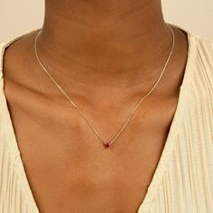 Corin Ruby is a stone of royalty, highly coveted for its rich red hue. This ruby was meticulously cut into the most subtle of hearts so you can wear it every day. It layers well with other dainty necklaces, and alone it almost looks like it is floating on your neck. This is the perfect gift for a girlfriend, daughter, granddaughter or even bridesmaid. - Handmade- Solid Gold- Natural Ruby- Pendant Size: 5 mm- Total Ruby Carat Weight: 0.40 ctw All Sarah Elise ruby jewelry come beautifully boxed in Cute Simple Ruby Necklace, Gold Necklace With Ruby Stone, Dainty Ruby Necklace As Gift, Dainty Gold Ruby Necklace, Classic Yellow Gold Ruby Necklace, Gold And Ruby Ring, Ruby Heart Necklace, Gold Gemstone Necklace, Ruby And Diamond Necklace