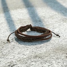 Available in coconut brown, this multi-strand adjustable bracelet features waxed leather cord. Size: Approximately 5mm thick. Masculine Adjustable Braided Bracelets With Leather Strap, Masculine Adjustable Braided Leather Bracelet, Adjustable Brown Leather Braided Bracelet, Casual Leather Bracelet With Adjustable Cord, Adjustable Leather Braided Bohemian Bracelets, Adjustable Braided Brown Jewelry, Adjustable Brown Braided Jewelry, Bohemian Adjustable Leather Braided Bracelets, Adjustable Bohemian Leather Braided Bracelets