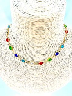 A colourful crystal gold chain choker, the perfect accessory to add a pop of colour and vintage charm to any outfit. Made for women who love to express their unique style, this boho-inspired choker features a beautiful combination of colourful crystals and a stunning gold chain.  Key Features: - Boho vintage design: The colourful crystal gold chain choker is designed to capture the essence of bohemian style with its vintage-inspired design. - High-quality materials: Made with premium materials, Gold Chain Choker, Circle Pendant Necklace, Round Necklace, Vintage Inspired Design, Chain Choker, Circle Pendant, Vintage Boho, Vintage Charms, Long Necklace