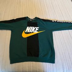 Good Condition, Never Worn Nike Sportswear Crewneck Sweatshirt. You’ll Be King Of The Playground Or Queen Of The Cafeteria With This Sweatshirt That Lets Everyone Know You Only Hangout With Winners. Sportswear Long Sleeve T-shirt With Graphic Print, Nike Sweatshirt With Logo For Streetwear, Varsity Long Sleeve Sports T-shirt, Nike Sporty Streetwear Sweatshirt, Green Sporty Hoodie With Ribbed Cuffs, Nike Sweatshirt With Letter Print For Sports Season, Sporty Fleece T-shirt For Streetwear, Green Cotton Sweater With Logo Print, Sporty Graphic Print T-shirt For Winter