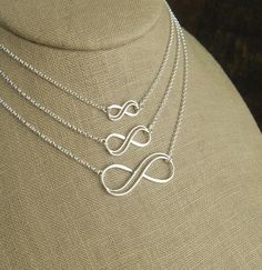 Sterling silver double infinity necklace, infinity knot, infinity symbol, bridal jewelry, sterling silver necklace, eternity necklace A double wire infinity link is attached to a sterling silver chain that can be any length up to 22 inches in length and is secured with a sterling silver lobster claw clasp. You can choose between the small, medium, and large infinity links. The small infinity measures 0.55 x 0.26 inches (14 x 6.5mm). The medium infinity measures 0.79 x 0.37 inches (20 x 9.5mm). T Silver Infinity Necklace In Dainty Style, Silver Infinity Dainty Necklace, Sterling Silver Infinity Necklace With Adjustable Chain, Silver Dainty Infinity Necklace, Silver Infinity Jewelry, Dainty Silver Infinity Necklace, Elegant Sterling Silver Infinity Necklace, Infinity Necklace With Delicate Chain For Wedding, Silver Infinity Jewelry With Adjustable Chain