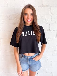 Malibu Crop Graphic Black Text Print Crop Top For Spring, Black Graphic Tee Crop Top For Spring, Black Graphic Print Cropped Shirt For Spring, Black Graphic Tee Crop Top For Summer, Spring Cropped Shirt For Streetwear, Trendy Summer Cropped Shirt, Sporty Graphic Print Cropped Shirt For Summer, Trendy Cropped Shirt With Logo Print, Trendy Cropped Shirt With Logo Print And Crew Neck