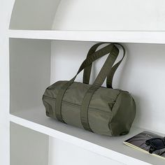 The Mini Nylon Duffle Bag is a simple bag made for everyday use! Made from durable nylon, the bag comes in a tube shape. Smooth zippers open up to a spacious interior that will easily fit all your daily essentials. Perfect for travel or even just a casual day out. Available in neutral colors that match any outfit, dress it up or down, the options are endless! Details• Made from Nylon• 13.1“W x 6.2“D x 7.0“H (33.5cm x 16cm x 18cm)• Ultra Lightweight• Spacious Interior• Zipper Main Compartment• Be Simple Bag, Lapel Pins Mens, Umbrellas Parasols, Outfit Dress, Toilet Accessories, Side Bags, Simple Bags, Types Of Bag, Daily Essentials