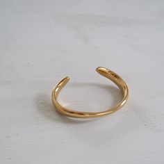 Curved Cuff Bracelet Minimalist Gold Metal Cuff Bracelet, Elegant Adjustable Brass Cuff Bracelet, Elegant Adjustable Cuff Rings, Gold Open Band Bangle Gift, Gold Resizable Cuff Bracelet Gift, Yellow Gold Plated Cuff Bracelet, Gold Plated Yellow Gold Cuff Bracelet, Elegant Adjustable Cuff Bracelet As Gift, Elegant Adjustable Cuff Bracelet For Gift