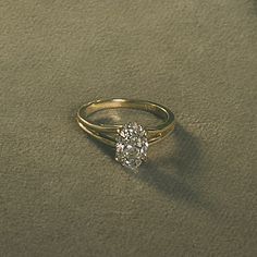 a gold ring with a diamond on it