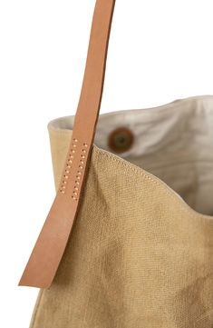 This incredibly roomy shoulder tote is crafted by artisans in Bangladesh, detailed by a row of stitches down the front and flaps of leather at the sides. The handmade jute-canvas bag meets Fair Trade standards, ensuring ethical process from start to finish. Style Name:Will & Atlas Archer Jute Tote. Style Number: 6254589. Everyday Hand-stitched Tote Shoulder Bag, Brown Rectangular Bucket Bag With Canvas Lining, Canvas Hobo Bag With Leather Handles, Everyday Rectangular Shoulder Bag With Hand-stitched Details, Everyday Hand-stitched Rectangular Shoulder Bag, Eco-friendly Shoulder Bag With Canvas Lining For Everyday Use, Everyday Rectangular Hand-stitched Shoulder Bag, Everyday Beige Shoulder Bag With Canvas Lining, Beige Shoulder Bag With Canvas Lining For Everyday