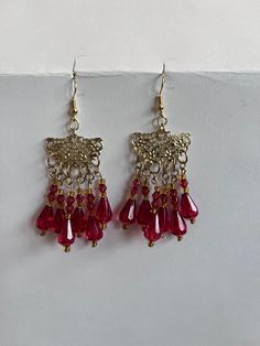 Red and gold dangly chandelier earrings Red Teardrop Chandelier Earrings As Gift, Vintage Festive Dangle Chandelier Earrings, Vintage Dangle Chandelier Earrings For Festive Occasions, Vintage Chandelier Dangle Earrings For Festive Occasions, Vintage Chandelier Drop Earrings For Festive Occasions, Festive Costume Jewelry Dangle Earrings, Elegant Red Teardrop Chandelier Earrings, Red Crystal Dangle Earrings For Party, Red Chandelier Earrings For Party