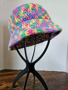 Dive into spring with these cotton bucket hats! These adorable hats will fit most adult heads.  20 cents of any rainbow item sold will be donated to a charity supporting the LQBTQ+ Community. Yarn is 85% recycled cotton and 15% polyester Washing Instructions: Machine wash warm. Tumble dry low heat. Do not iron. Wash color separately, some colors may run. Due to the handmade nature of our products, there may be slight variations in color and/or craftsmanship. I strive to provide the best quality, all products are made at my in home craft area. Product may have some slight imperfections as all available items are 100% handmade. Colors my vary slightly from image shown based on lighting and screen settings. Playful Multicolor Cotton Sun Hat, Trendy Multicolor Cotton Hats, Playful Cotton Sun Hat One Size, Spring Adjustable Cotton Crochet Hat, Spring Cotton Adjustable Crochet Hat, Fun Adjustable Cotton Bucket Hat, Adjustable Fun Cotton Bucket Hat, Adjustable Cotton Crochet Hat For Spring, Adjustable Fun Style Cotton Bucket Hat