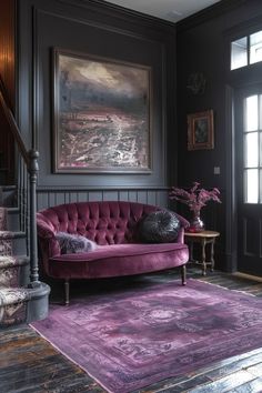 a living room with a purple couch and rug