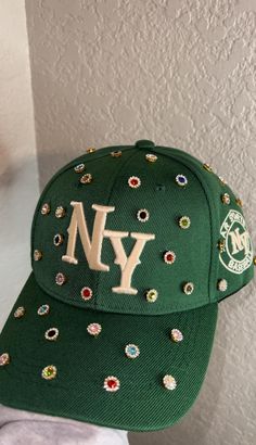 Adjustable NY Custom Bedazzled Hat customed by ShanayCosmetics Comes in 4 colors: Black-Green-Denim-Pink PLEASE KEEP IN MIND THAT I AM NOT RESPONSIBLE FOR ANY DELAYS WITH SHIPPING ONCE I HAVE DROPPED YOUR PACKAGE OFF AT THE POST OFFICE! THAT IS OUT OF MY CONTROL. PLEASE BE AWARE I AM NOT RESPONSIBLE FOR ANY LOST, DAMAGED OR STOLEN PACKAGES!! Trendy Snapback Baseball Cap With Rhinestones, Trendy Rhinestone Snapback Baseball Cap, Trendy Rhinestone Hats For Spring, Trendy Snapback Hat With Rhinestones, Trendy Rhinestone Baseball Cap, Trendy Rhinestone Cap, Trendy Rhinestone-embellished Cap, Green Ny Hat, Bedazzled Hat