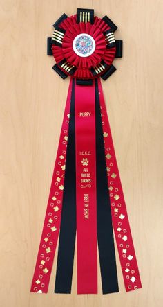 a red ribbon with black ribbons around it