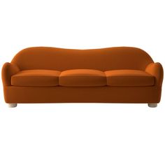 an orange couch sitting on top of a white floor