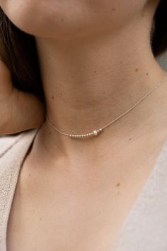 This dainty choker is hand-made of 925 sterling silver beads and a single freshwater pearl. The necklace is a perfect everyday jewelry piece. Length:   ● 35 cm with a 5 cm extension  Lengths are measured from end to end, the clasp is included in the measurements. The choker will include an additional 3 cm extension chain. Want to see more jewelry from my shop? click here: http://etsy.me/2uPuv0x ● The item will be shipped beautifully wrapped, as shown on the last picture of the listing, and ready Sterling Silver Choker, Dainty Choker, Silver Choker, Chain Choker Necklace, Chain Choker, Minimalist Necklace, Delicate Necklace, Everyday Jewelry, Sterling Silver Bead