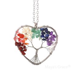 Embrace positive energy with the Maya's Grace Chakra Necklace. This vibrant pendant adds a pop of color to any outfit and features an 18-inch silver cable chain with a 2-inch extension and lobster clasp. Each crystal in the pendant represents a unique quality: Purple: Symbolizes romance and nobility. Tiger's Eye: Enhances inspiration and career success. White: Associated with wisdom and clarity. Pink: Represents love and popularity. Yellow: Symbolizes wealth and good fortune. Tawny: Stands for stability. Green: Represents justice and growth. Jewelry Care: Store in a clean, dry place. Do not wear in water or during sports activities. Clean gently with a soft cloth. About Maya's Grace: At Maya's Grace, a minority-owned brand, our mission is to make beautiful, high-quality jewelry accessible Spiritual Natural Stones Jewelry For Mother's Day, Spiritual Gemstone Beads Jewelry For Valentine's Day, Spiritual Heart Beads Pendant Necklace, Spiritual Heart Beads Jewelry For Gifts, Spiritual Heart Beads Necklaces As Gifts, Spiritual Necklace With Heart Beads For Gifts, Spiritual Necklaces With Heart Beads For Gifts, Rainbow Gemstone Beads Jewelry For Gifts, Rainbow Natural Stones Jewelry As Gift