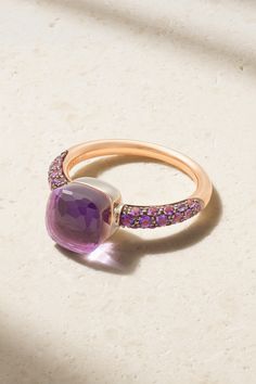 Pomellato's 'Nudo Classic' ring shimmers in gorgeous, regal shades of purple. Cast from rhodium-plated 18-karat rose and white gold, it's set with a faceted amethyst and layered with a 4.90-carat jade. 32 smaller amethysts stud the band, enhancing the other stones' natural beauty. Luxury Multi-stone Amethyst Wedding Ring, Elegant Multi-stone Amethyst Ring In Yellow Gold, Luxury Rose Gold Amethyst Ring, Luxury Rose Gold Amethyst Ring As Gift, Luxury Pink Amethyst Ring With Accent Stones, Elegant Green Amethyst Ring, Purple Brilliant Cushion Cut Rings, Luxury Pink Amethyst Gemstone Ring, Purple Cushion Cut Brilliant Ring