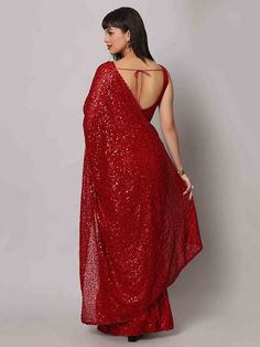 Wear this stunning red sequins georgette cocktail party wear a saree with a blouse and make heads turn at any event. Designed with intricate sequin work and a beautiful sequin floral border, this saree is made from high-quality georgette material that ensures comfort and elegance. The heavy sequin work on both the saree and blouse adds a touch of glamour to your outfit, making it perfect for parties and receptions.
This designer saree comes in a vibrant red color that exudes grace and sophistica One Minute Saree, Formal Saree, Saree With Belt, Floral Print Sarees, Saree Sale, Readymade Saree, Party Wear Saree, Georgette Blouse, Silk Saree Blouse