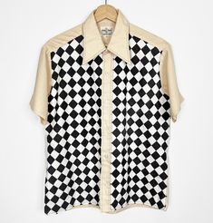 Vintage 70s button-up shirt that has been renewed with added cotton checkerboard printed fabric. Original shirt is 65% polyester 35% cotton. Marked size M, please check measurements to ensure fit. FREE DOMESTIC SHIPPING! Measurements taken flat across shirt: Bust: 22" Length: 26.5" Sleeve: 8.5" Shoulder to shoulder: 17.75" all sales final Seventies Fashion, Printed Fabric, Mens Clothing Styles, Vintage 70s, Favorite Outfit, Button Up Shirts, Printing On Fabric, Button Up, Adult Outfits