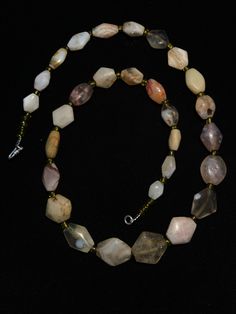 A beautiful string of Bended white agate natural found from Afghanistan dating 1800 yrs. They are found at that time in Afghanistan mostly but also some found in India and Pakistan too. They were used as a special charm jewellery by the affluents at that time period. Beautiful counter bronze are decorated further in between the beads. Chalcedony Gemstone Necklace With Round Beads, Chalcedony Round Bead Jewelry For Gifts, Spiritual Round Chalcedony Bead Jewelry, Agate Amulet For Healing, Spiritual Tumbled Agate Jewelry, Vintage Gemstone Beads Jewelry For Healing, Healing Single Strand Round Bead Gemstones, Agate Rondelle Natural Stone Jewelry, Rondelle Agate Jewelry With Natural Stones