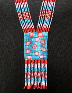 Cheetah pattern colorful long seed bead necklace with fun fringe. This necklace says summer, beach, resort. Necklace measures 16 inches, pendant measures 4 1/2 inches from top to the bottom of the fringe. No clasp, just slip over your head. Striking with a swingy beach dress or a jean jacket. Shop more necklaces here: https://www.etsy.com/shop/BoutiqueByMaryam?section_id=21694658 Be sure to visit the rest of my shop here: https://www.etsy.com/shop/boutiquebymaryam Multicolor Beaded Lariat Necklace With Round Beads, Long Beaded Festival Necklaces With Dangling Beads, Festival Long Beaded Necklaces With Dangling Beads, Long Beaded Necklaces With Dangling Beads For Festivals, Beaded Lariat Necklace For Festival, Southwestern Style Multicolor Necklace For Beach, Southwestern Multicolor Beaded Necklaces For Beach, Southwestern Style Multicolor Beaded Necklaces For Beach, Southwestern Style Multicolor Beaded Necklace For Beach