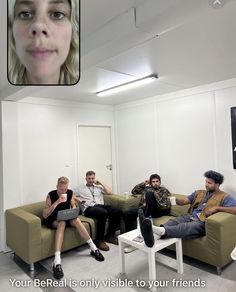 a group of people sitting on couches in a room