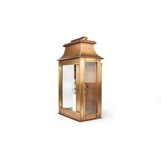 an old fashioned brass lantern on a white background