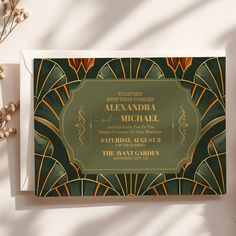 an art deco style wedding card with gold and green accents